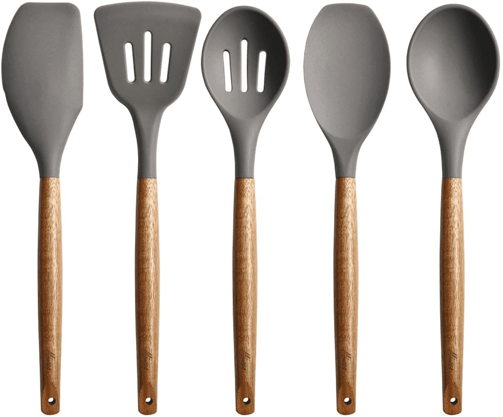 Stainless steel kitchen utensils set with wooden handles for cooking and baking.